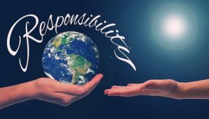 Two hands holding a world with the word "responsibility"