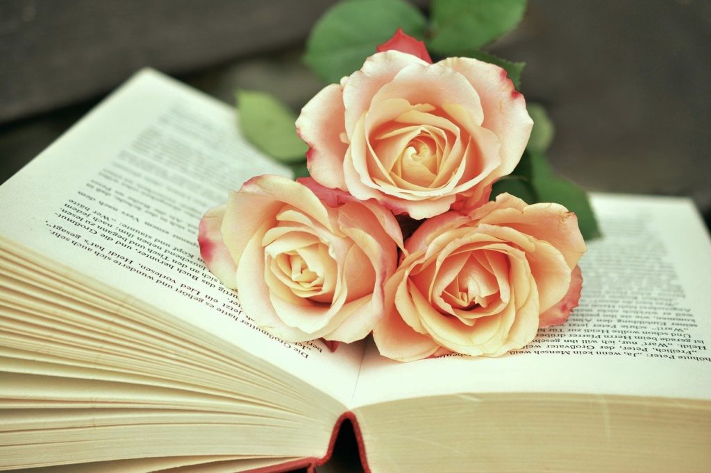 Open book with orange flowers