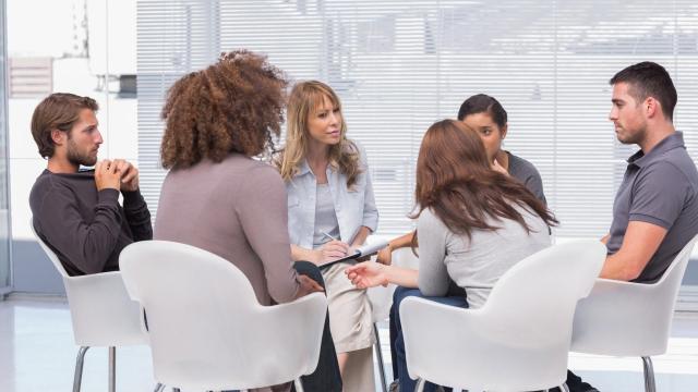 Focus Group Composition. Image of 6 people sitting in a circle in white chairs.