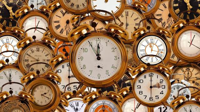 Image of several golden clocks.