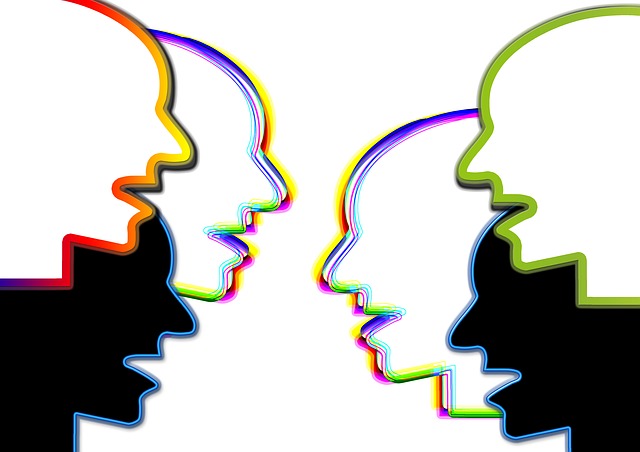colorful outlines of human heads talking to each other
