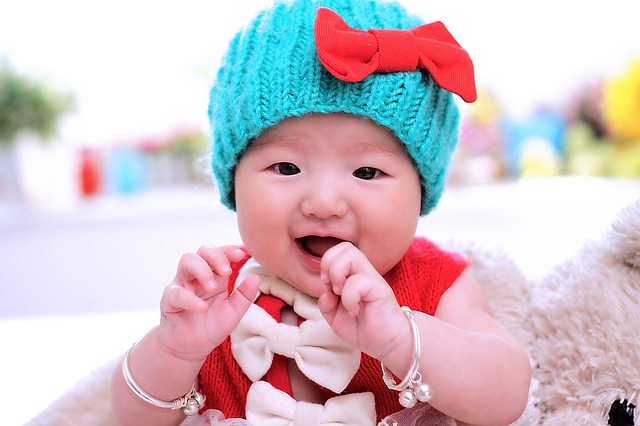 First language acquisition. Image of an Asian baby.