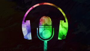 a multicolored microphone and set of headphones on a black background